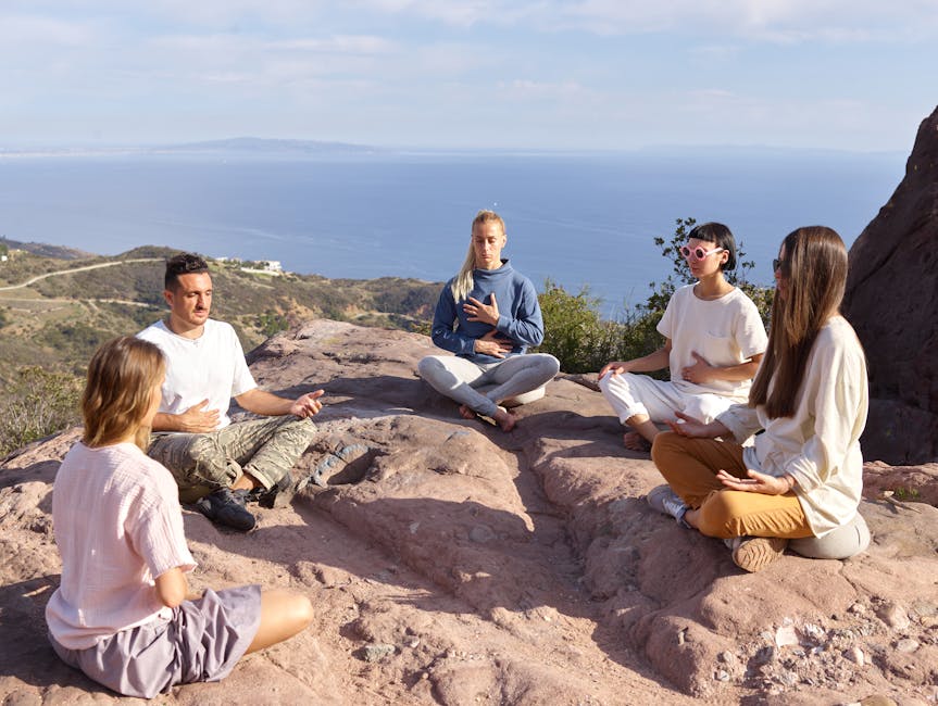 Group of people practicing yoga outdoors